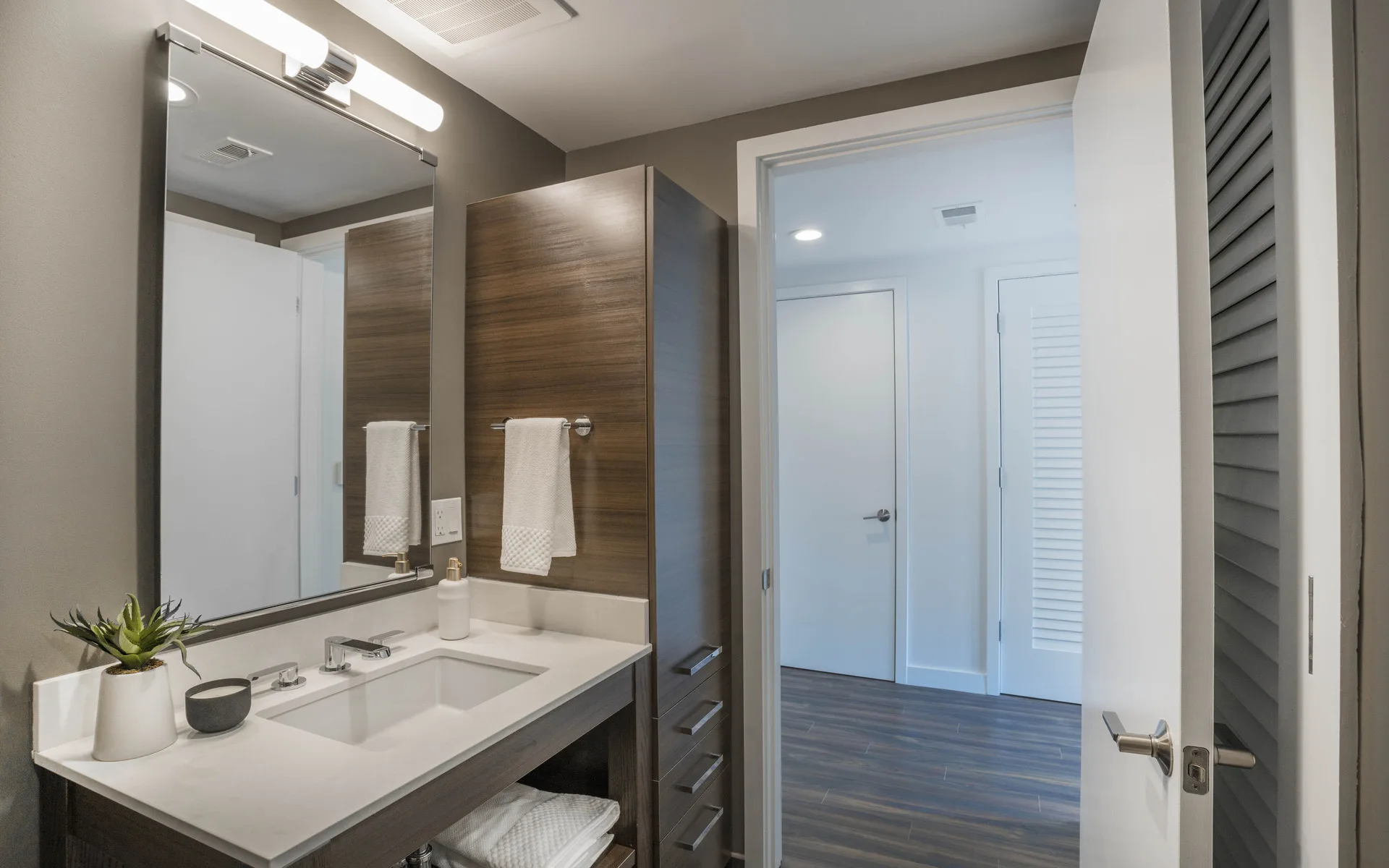 Bathroom sink with dark cabinets